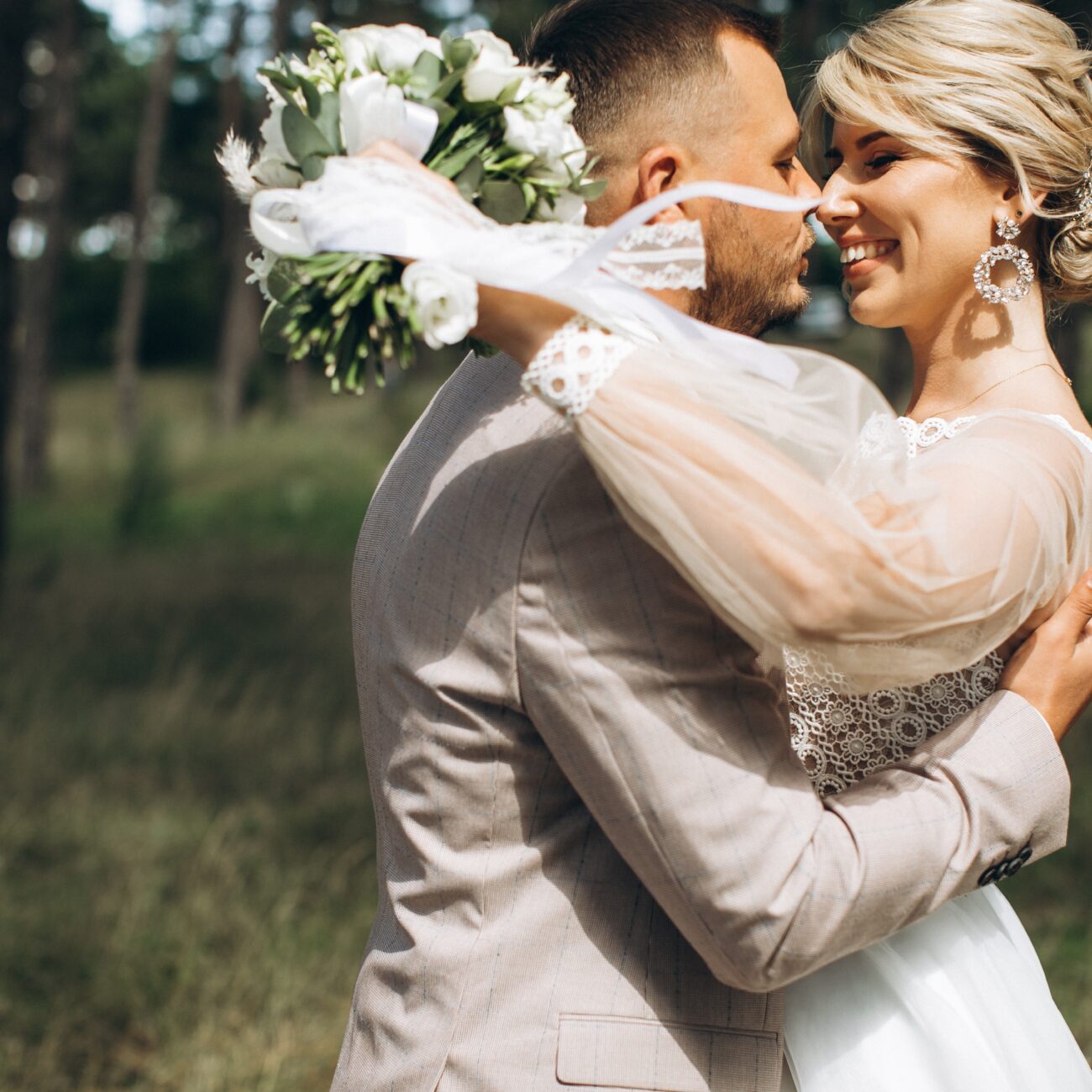 Wedding,Couple,Bride,And,Groom,Kisses,And,Walk,In,Pine