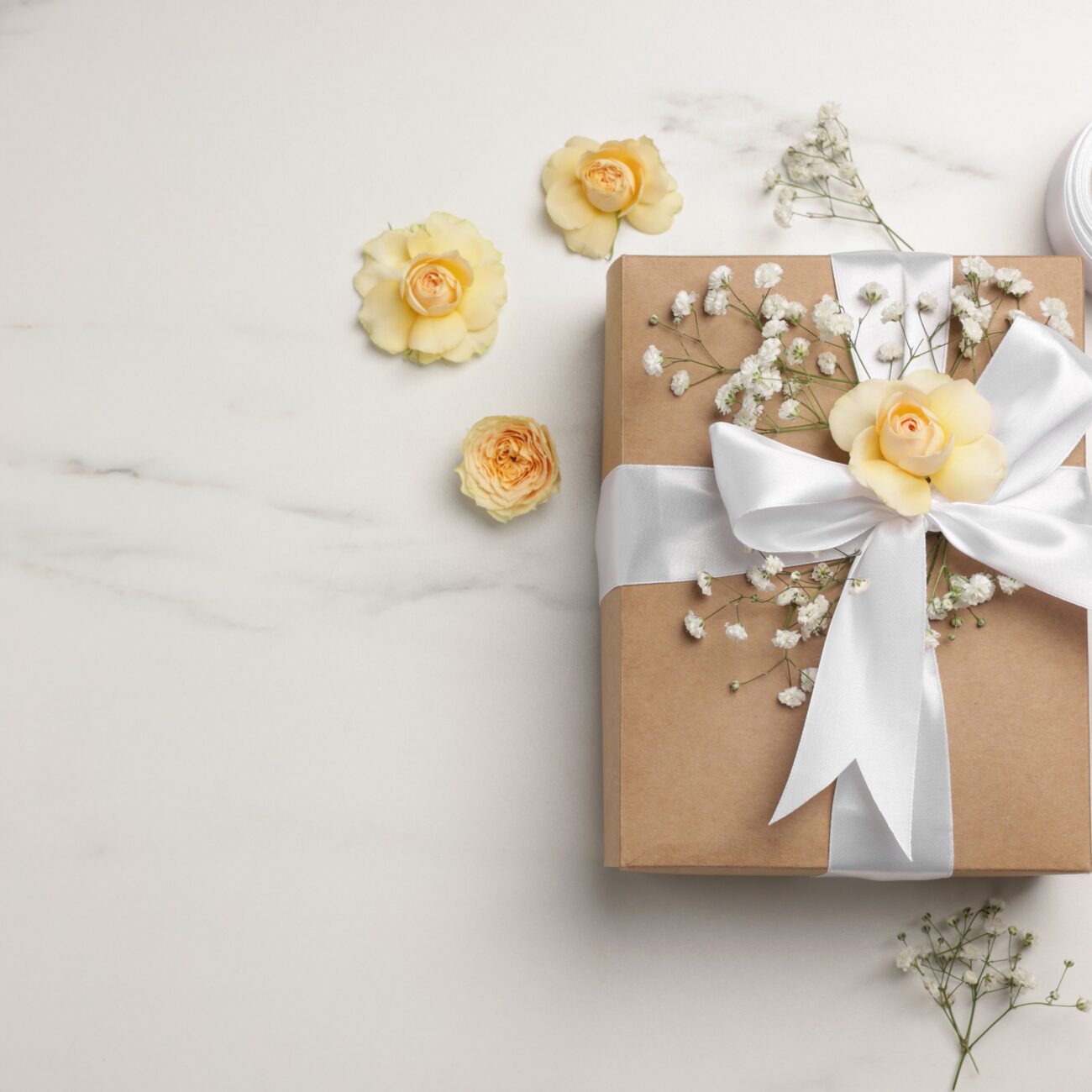 Florist.,Box,,Flowers,And,Ribbon,On,White,Marble,Table,,Flat