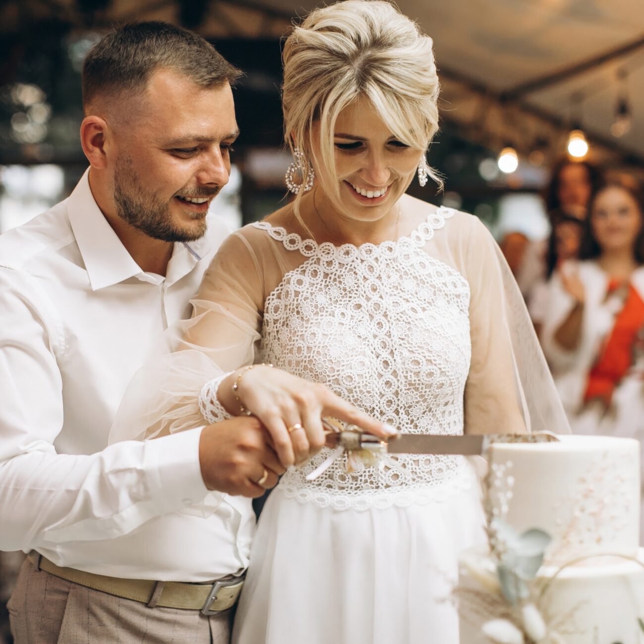 The,Wedding,Cake.,The,Bride,And,Groom,Cut,Off,A